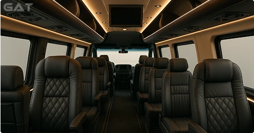 Mercedes 16 seater minibus interior with 2+1 executive seating, overhead luggage, climate control and media screen.