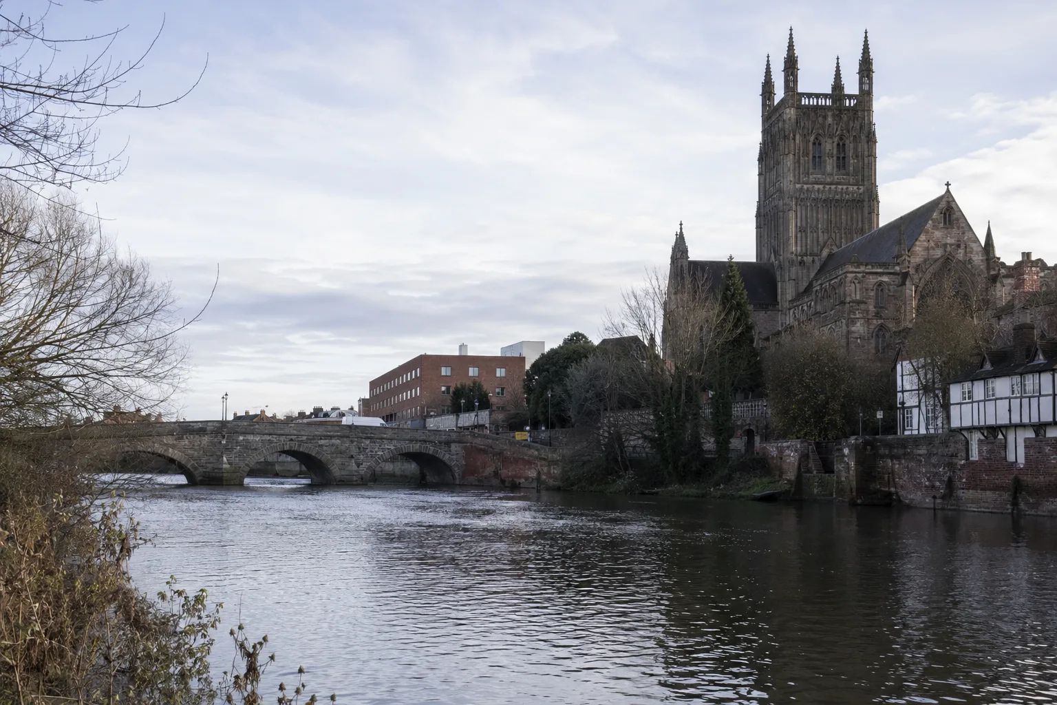 Quiet riverside cityscape with gothic architecture